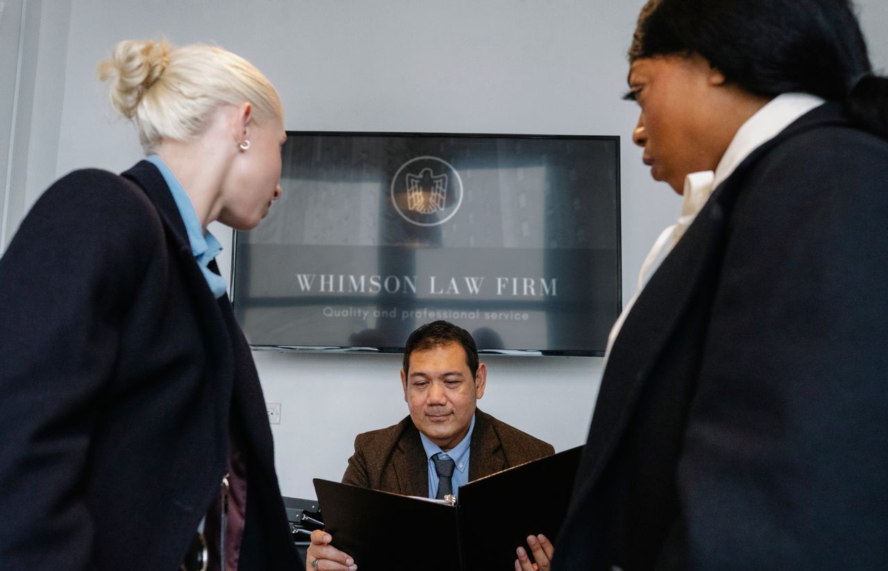 The Art of Drawing Readers In: Your attractive post title goes here Diverse colleagues gathering in conference hall of law firm and discussing details of contract while working together